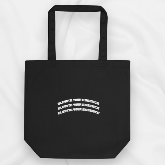 eco friendly black tote bag with slogan 'elevate your essence' across the bag 3 times.